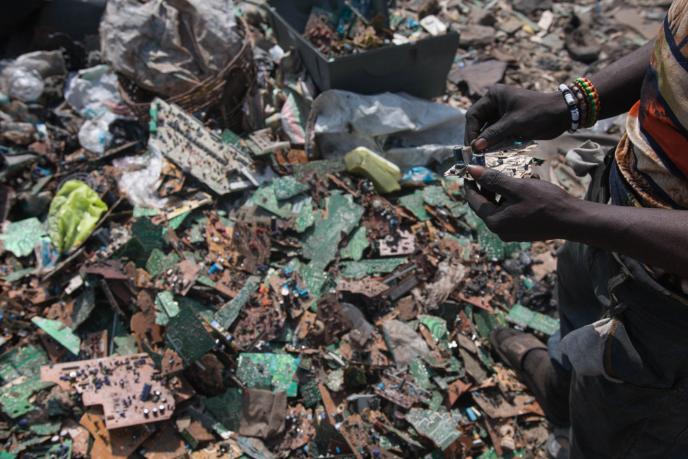 Accra, Ghana - March/April 2016 Worker in the dump of Agbogbloshie
