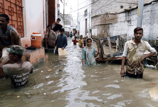 KARACHI, PAKISTAN - AUG 22: Residents are facing difficulties due to flooded area caused by heavy downpour of monsoon season due to poor sewerage system, on August 22, 2020 in Karachi.