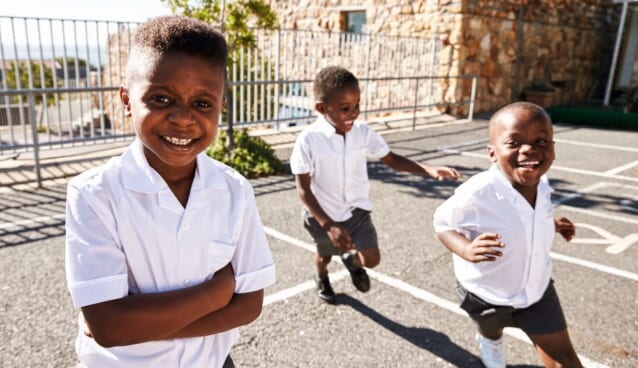 Young,African,Schoolboys,Running,In,School,Playground