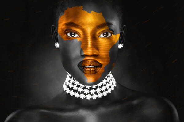 an africa symbol image on the beautiful african face of a young