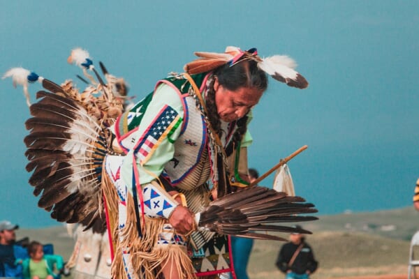 a man wearing headdress Lakota, Native American Man at Pow Wow