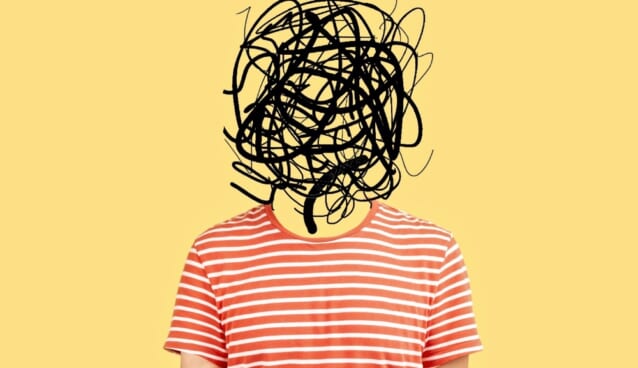 Frustrated man with nervous problem feel anxiety and confusion of thoughts. Mental disorder and chaos in consciousness. Indoor studio shot isolated on yellow background